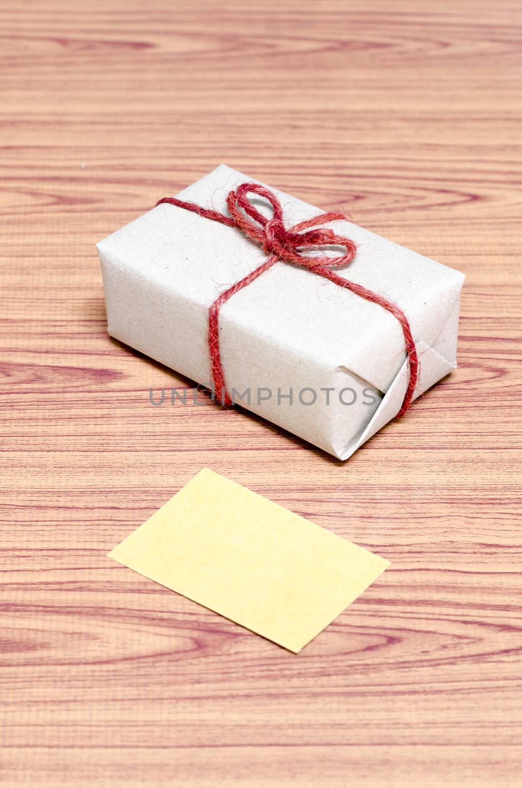 brown gift box and card on wood background