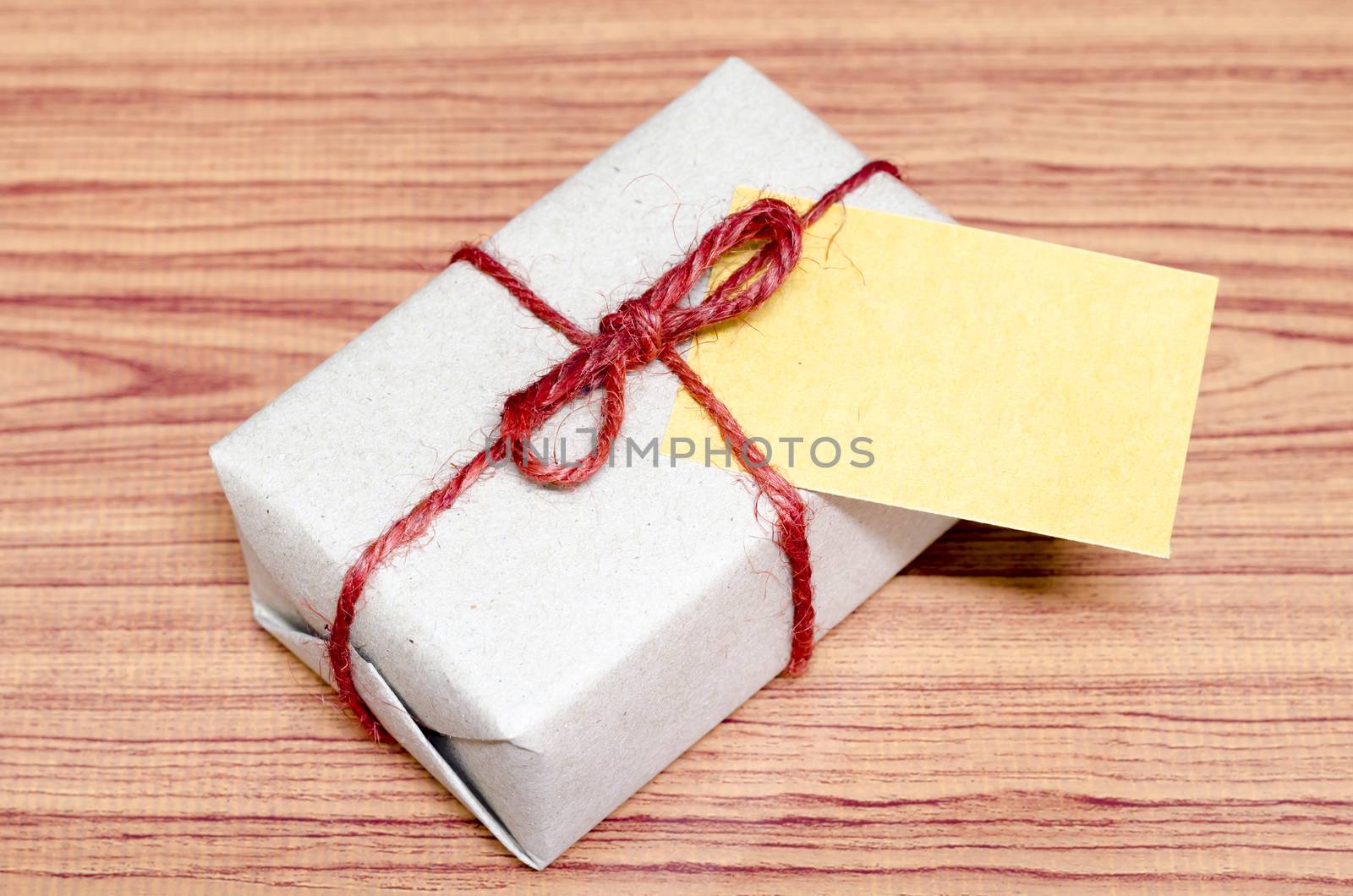 brown gift box and card on wood background