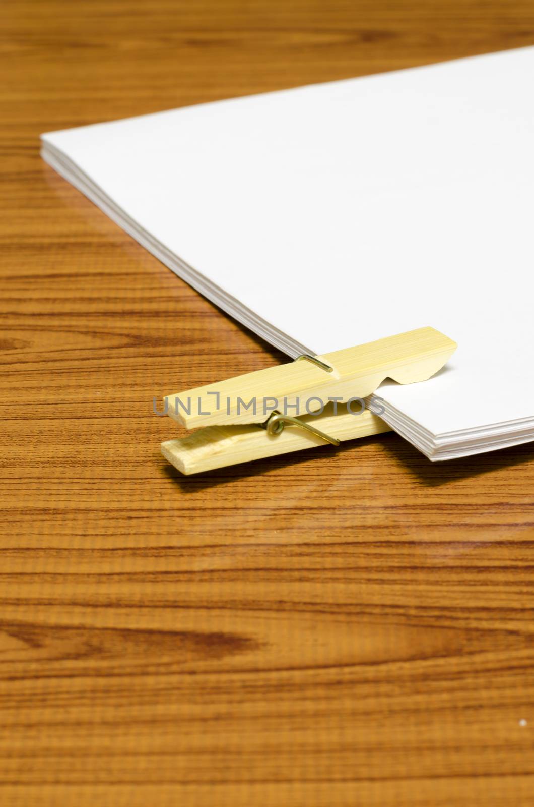 wooden pin paper on wood background