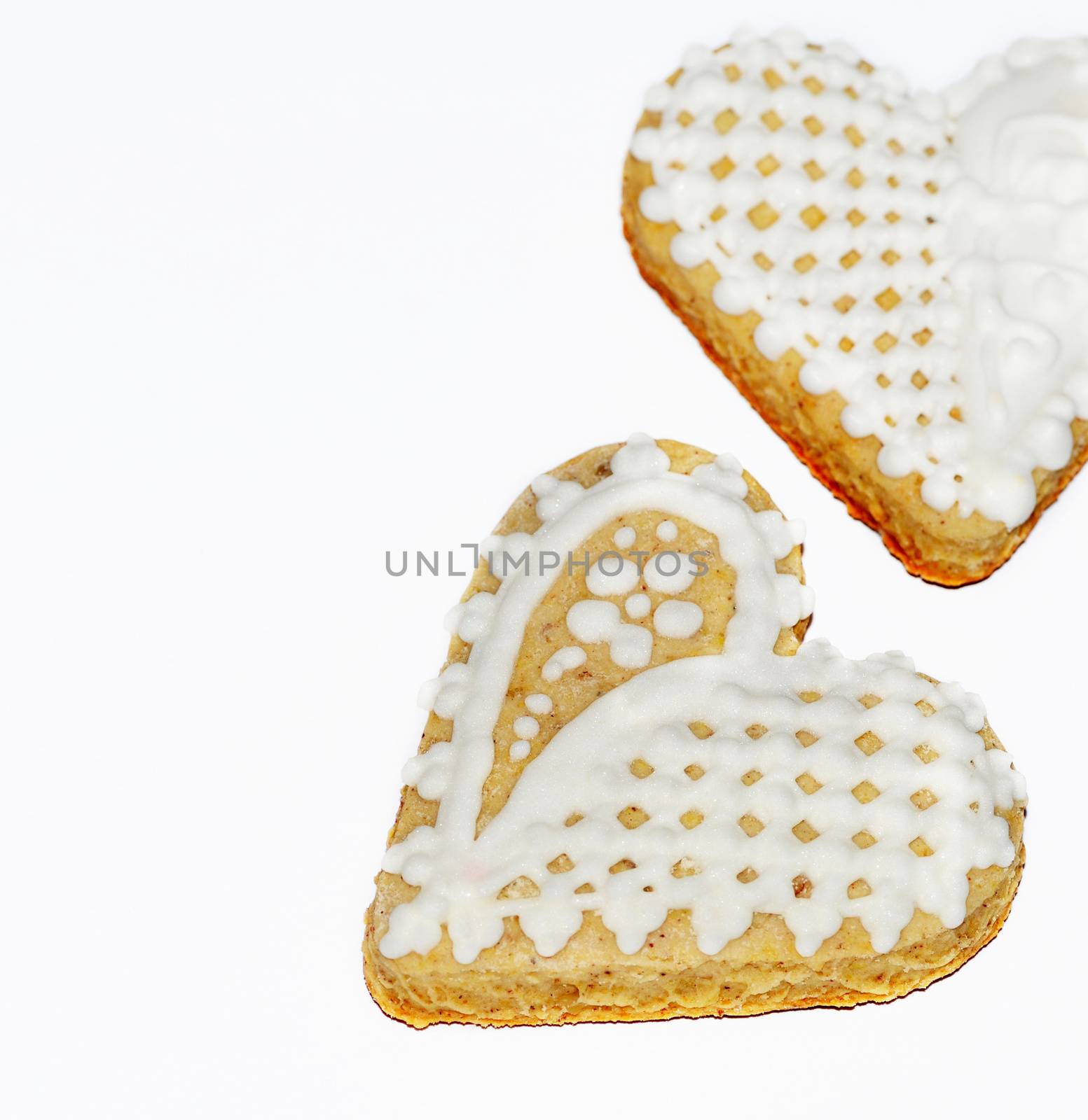 background two traditional white trimmed gingerbread hearts