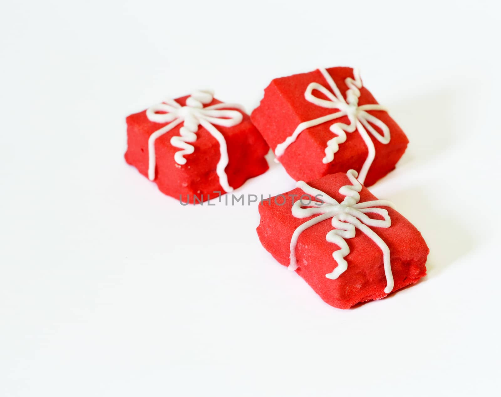 brightly red sugar cookies on a white background