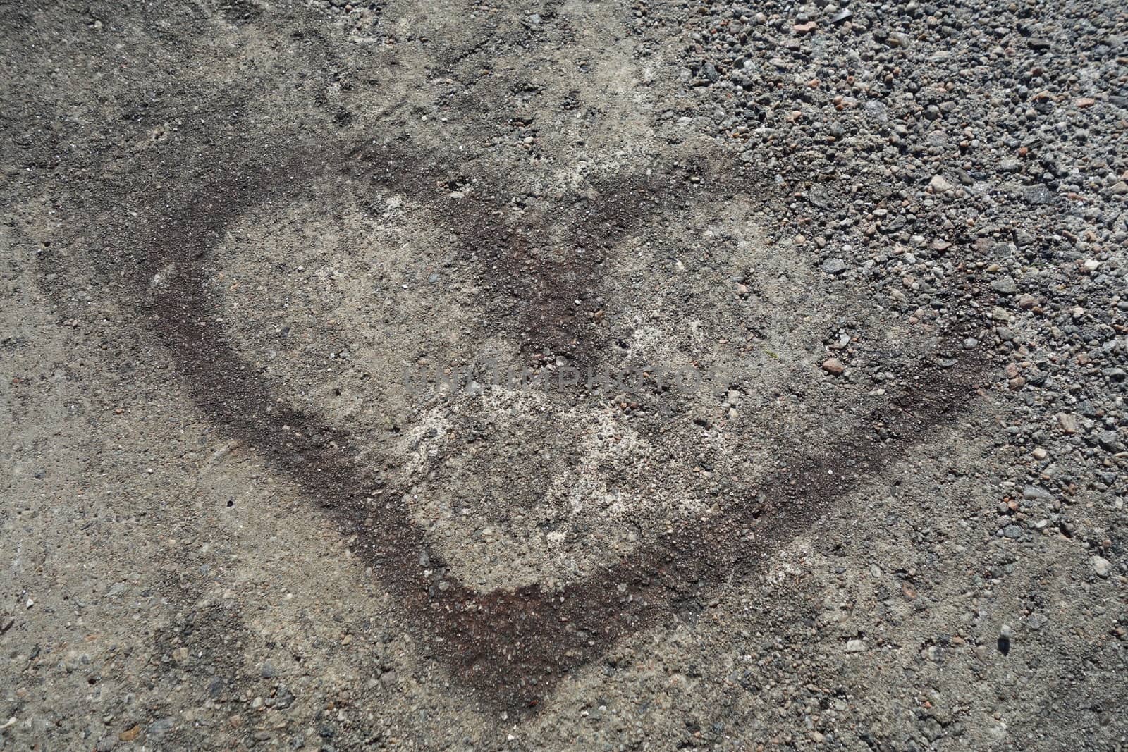 Heart mark in cement seen at a public swimming area