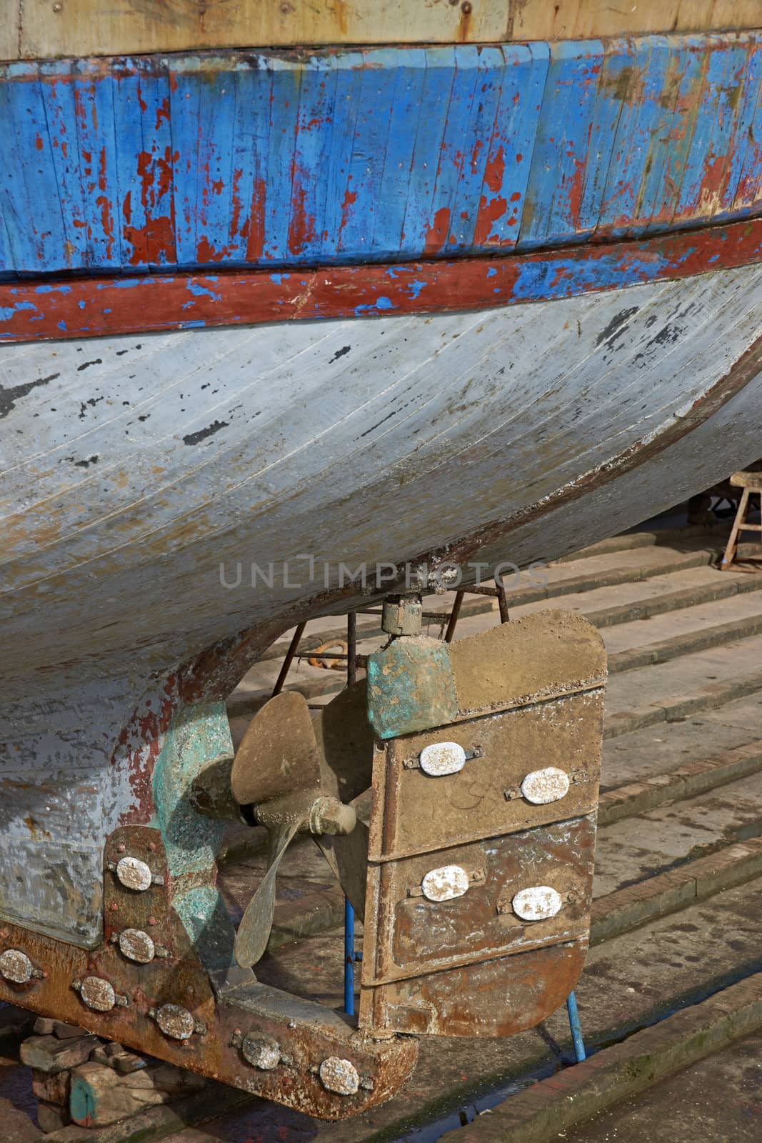 The rudder of a large fishing boat on a slipway in the historic harbour of Essaouira in Morocco.