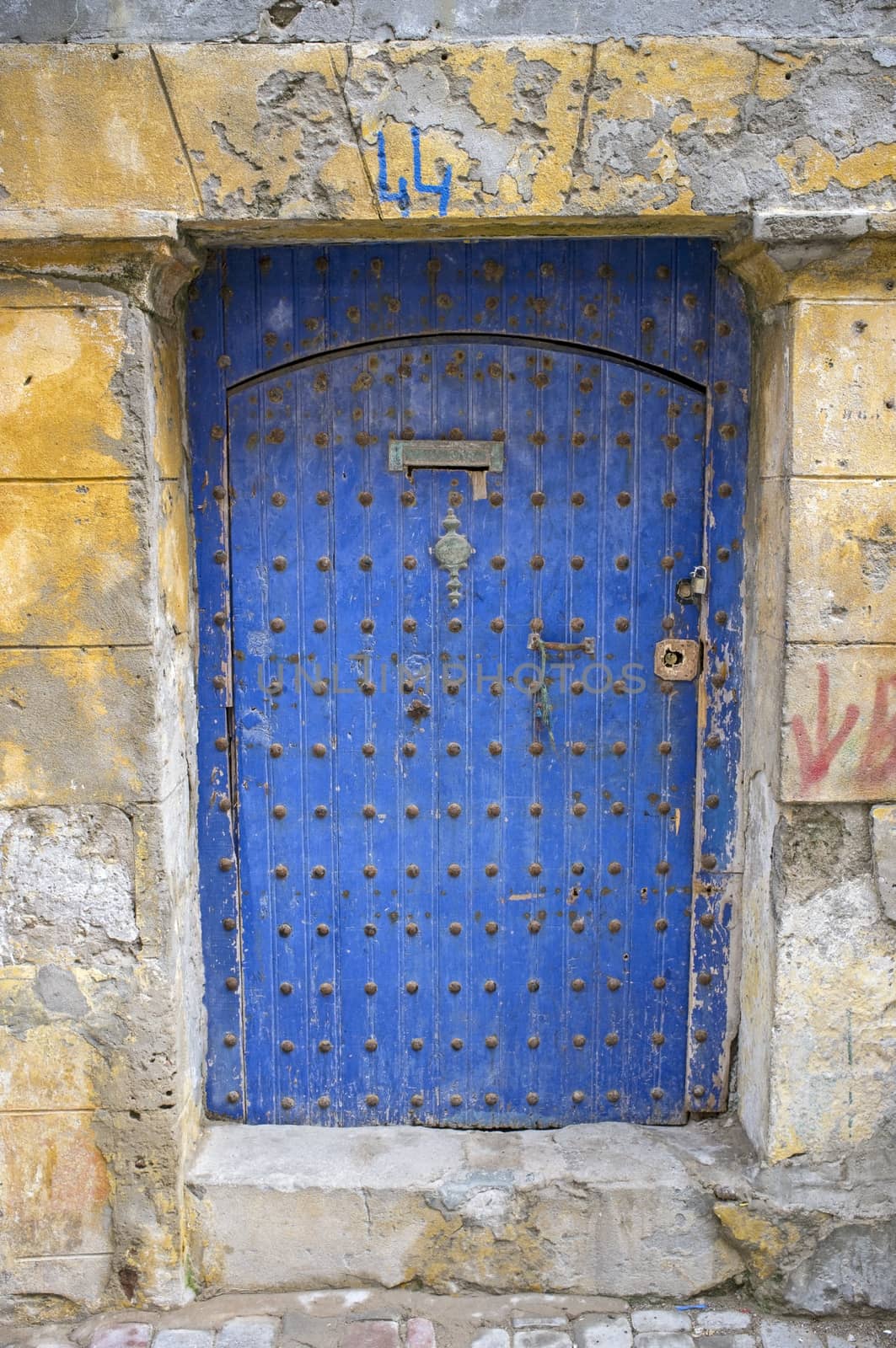 Traditional wooden door in the historic fishing port of Essaouira in Morocco.