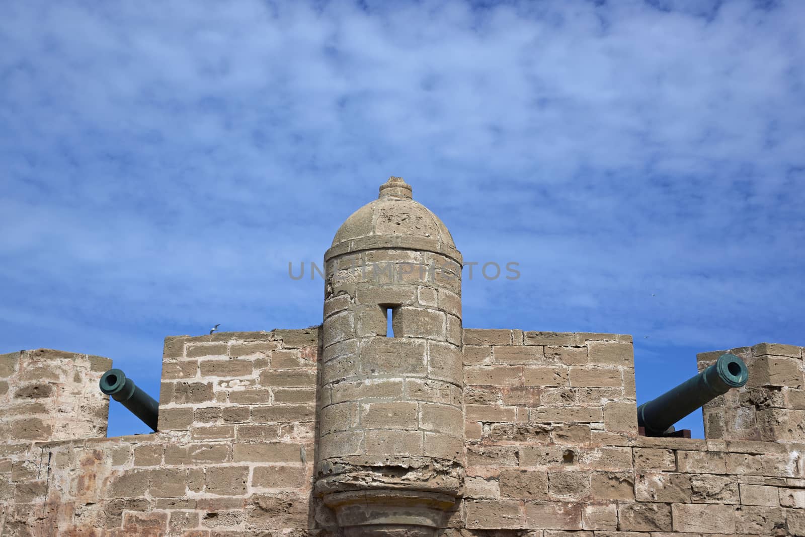 Fortified tower guarding the historic fishing port of Essaouira in Morocco.