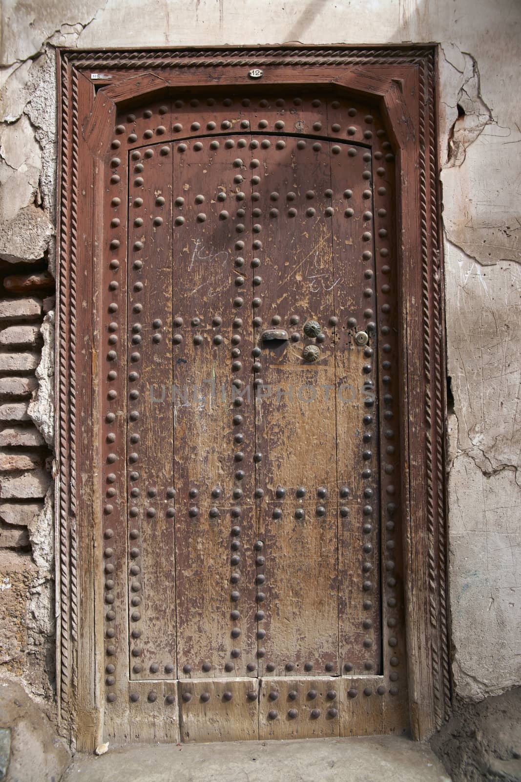 Traditional wooden door in the historic fishing port of Essaouira in Morocco.