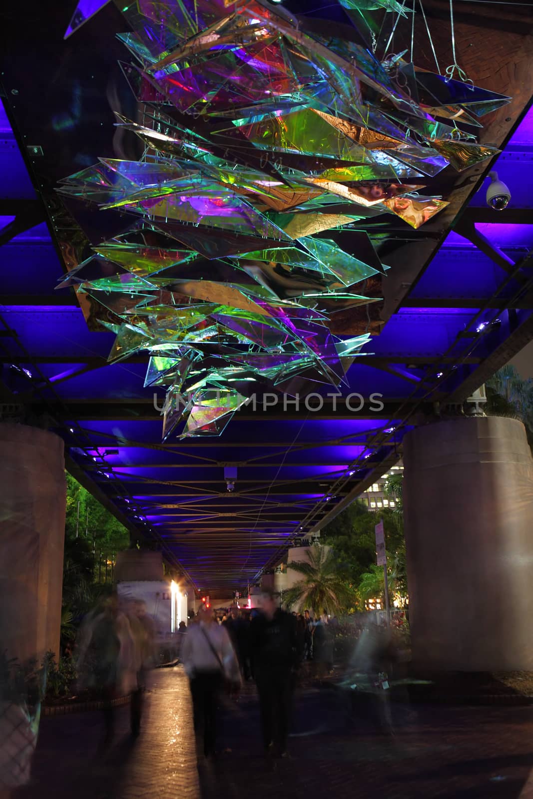 SYDNEY, NSW, AUSTRALIA - JUNE 4, 2014;  People looking up while walking under Made You Look during Vivid Sydney.  Using mirrors and projected images, this installation is interesting and fluctuating  every swell and lull of pedestrian traffic changes it. It will never be the same at any two points in time.  People in motion