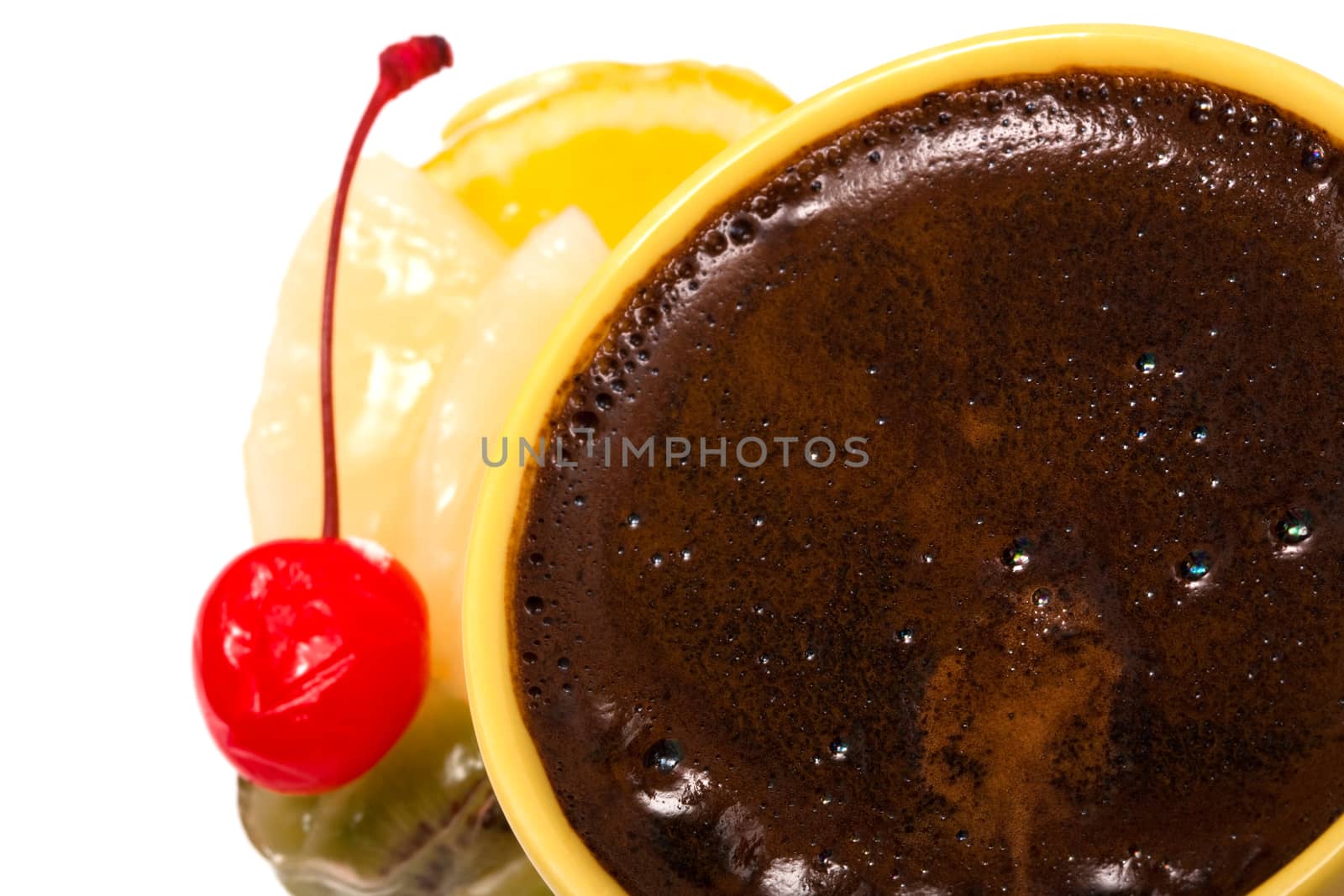 Cup from coffee and a dessert with fruit