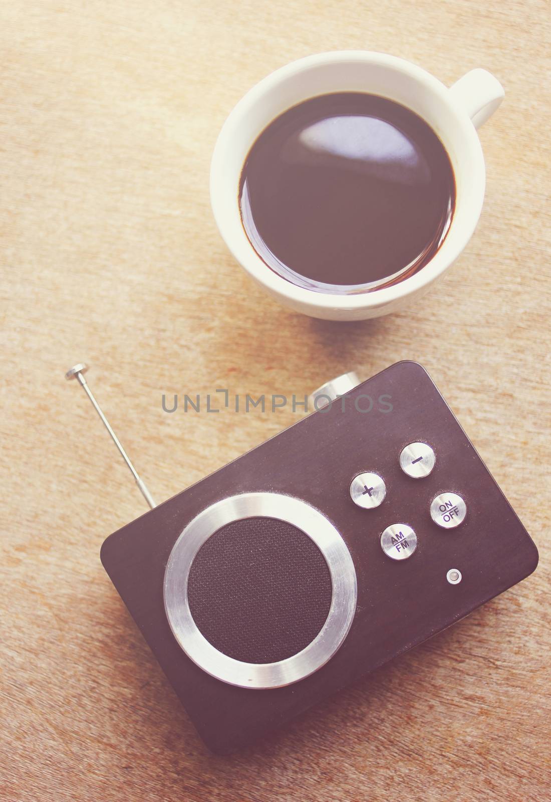Retro radio and black coffee with retro filter effect