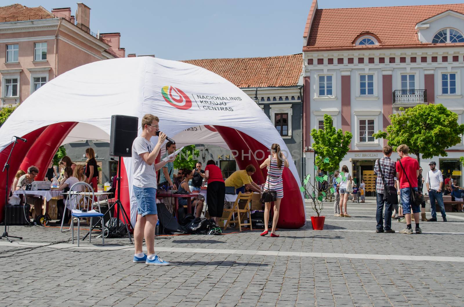 VILNIUS, LITHUANIA - MAY 18: man speaks through microphone on the street to the big event tent on May 18, 2013 in Vilnius.