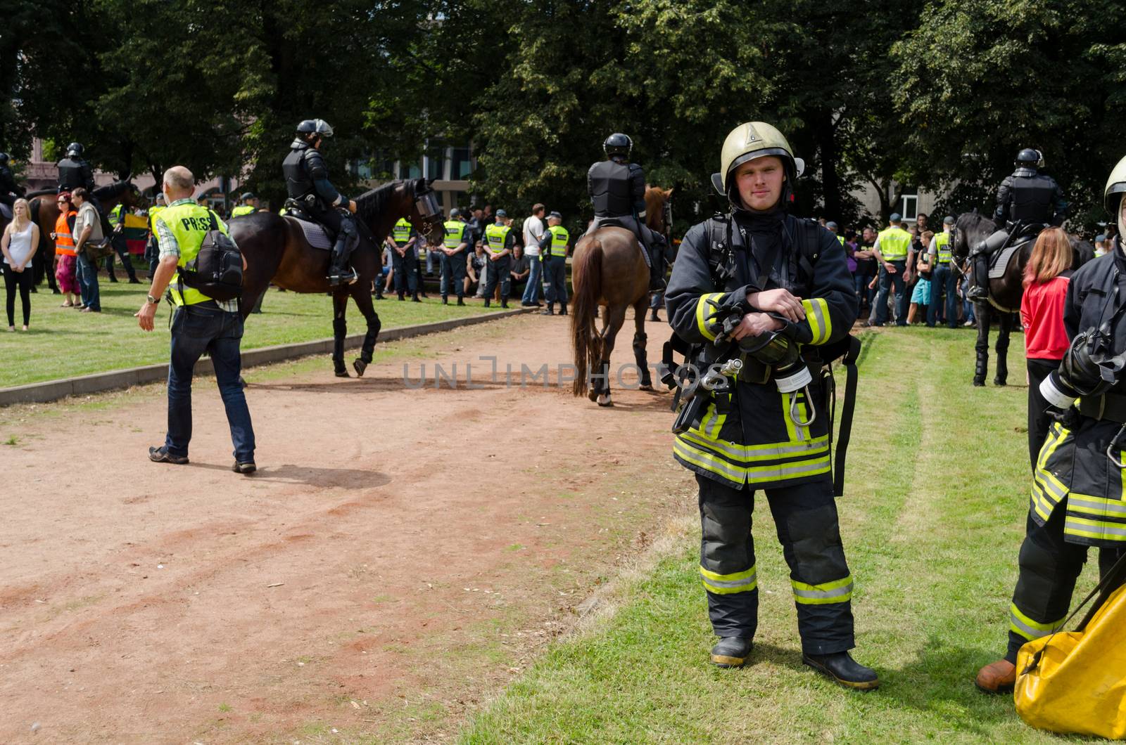 VILNIUS, LITHUANIA - JULY 27: rescue teams fireman with special clothing and equipment through large public event in the city park on July 27, 2013 in VILNIUS, Lithuania.
