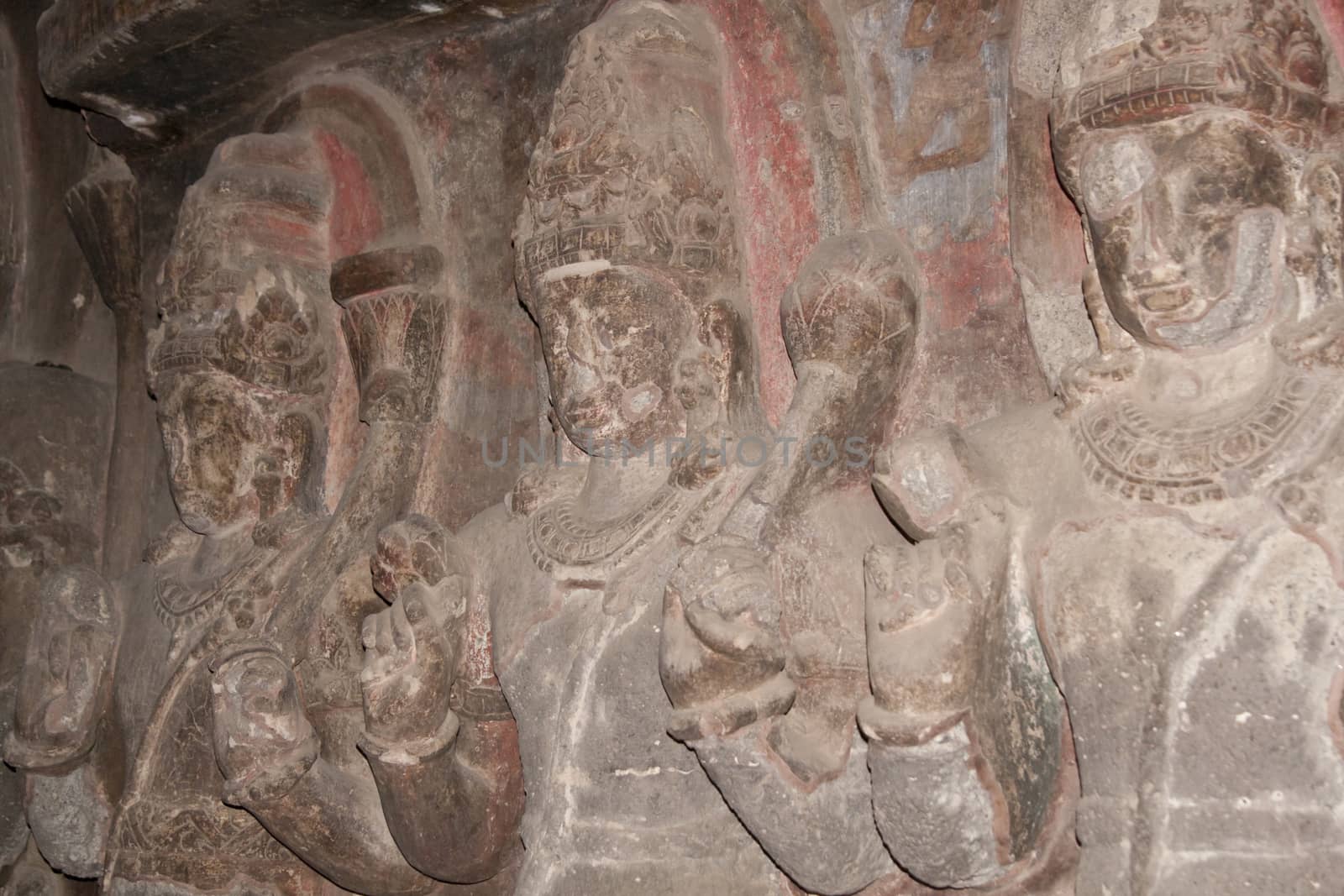 Carvings of religious figures inside a Buddhist rock cave (Teen Daal). Cave number 12, Ellora Caves, near Aurangabad, India. 7th - 8th Century AD