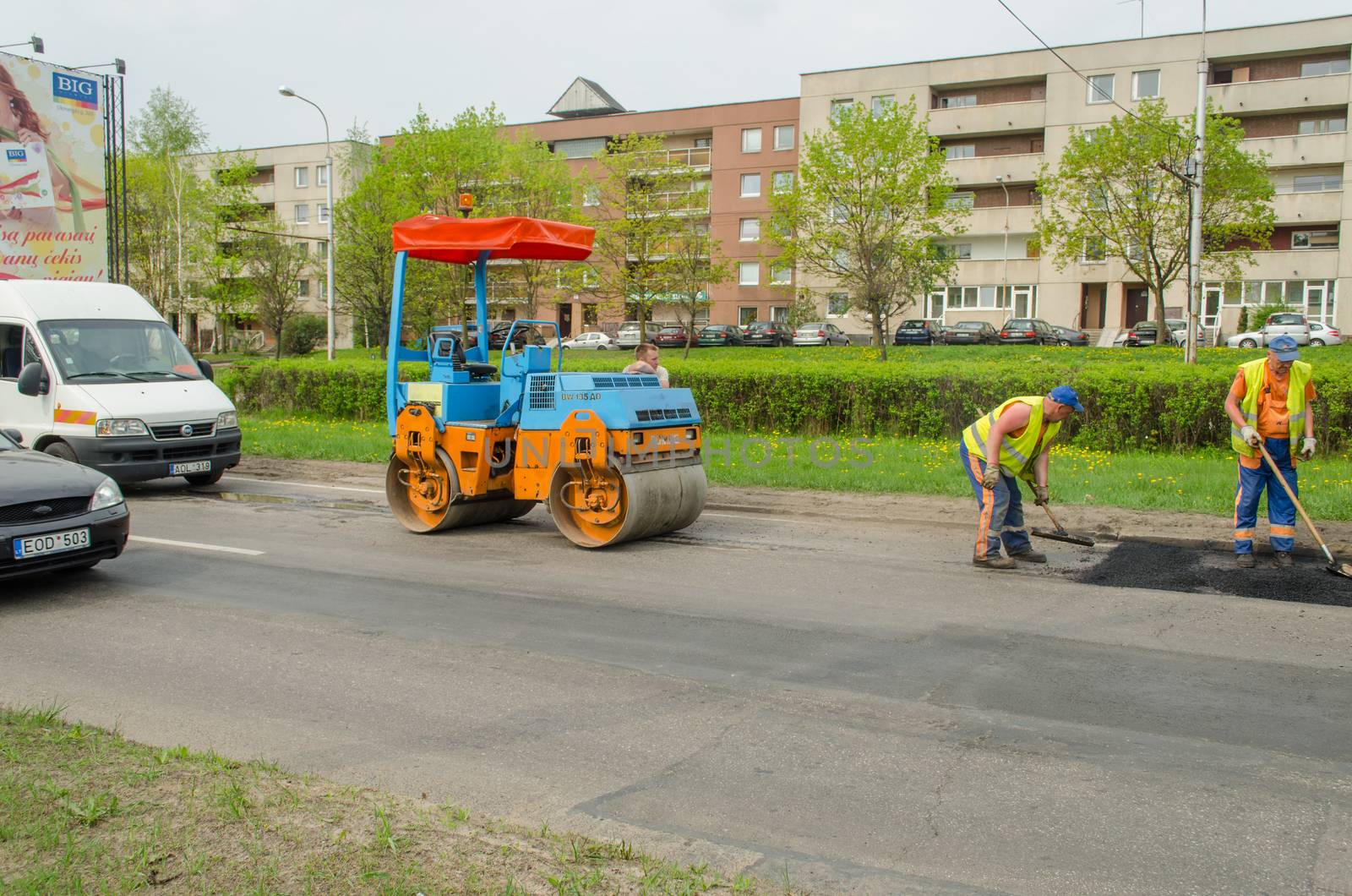 VILNIUS, LITHUANIA - MAY 11: road roller and asphalt paving machine at construction site street on May 11, 2013 in Vilnius.