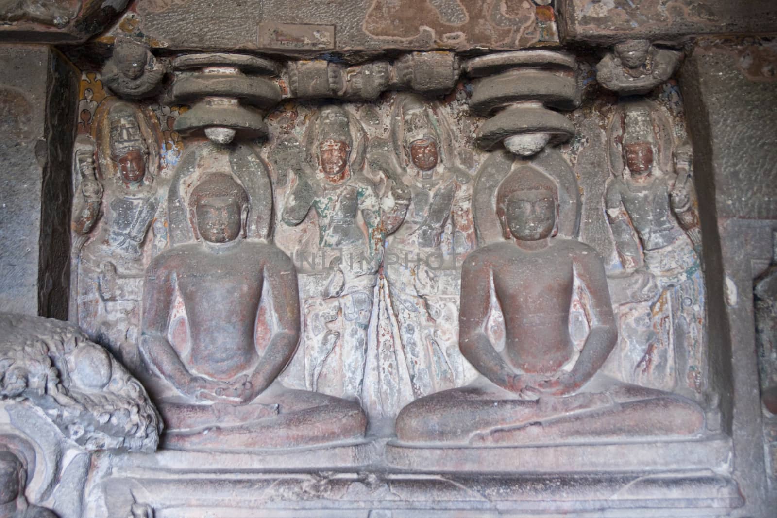 Religious images carved into solid rock inside an ancient Hindu cave temple, Ellora Caves near aurangabad, India.