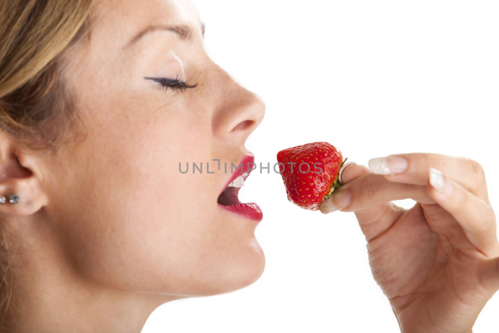 woman eating a strawberry