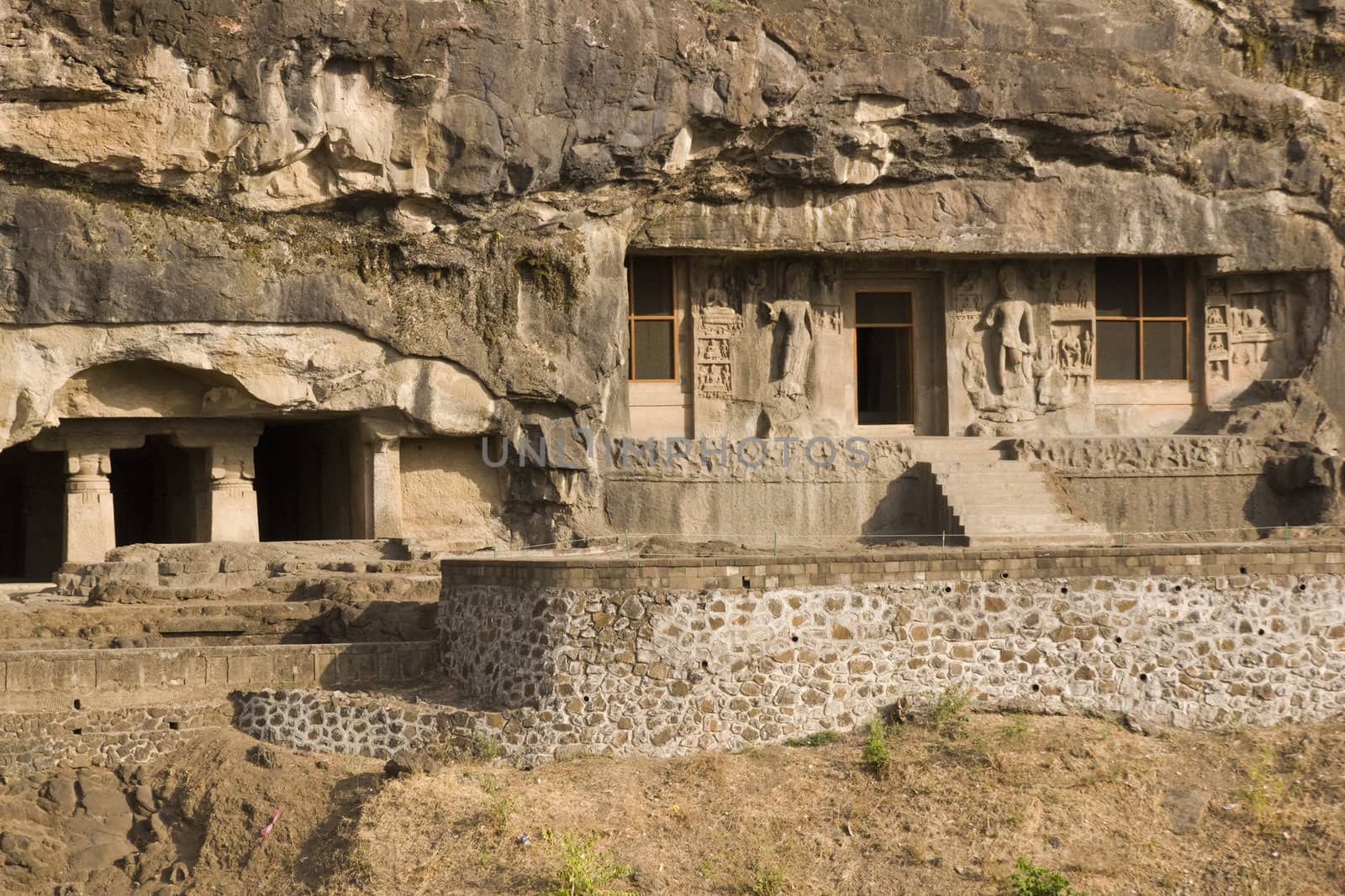 Buddhist cave temples carved out of the solid rock of the hillside at Ellora Caves in India. 7th-8th Century AD
