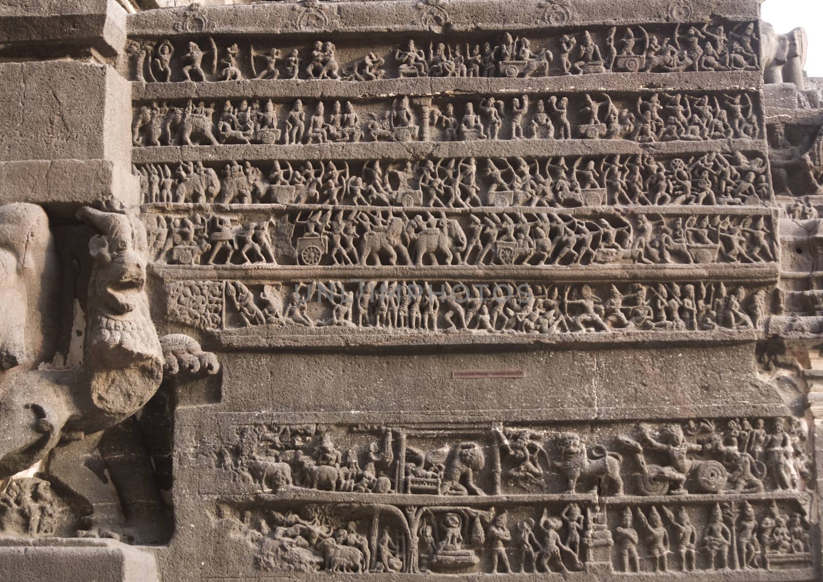 Hindu religious story carved into the rock face at the ancient Hindu Temple (Kailas Temple). Cave number 16, Ellora Caves site, India. 8th Century AD