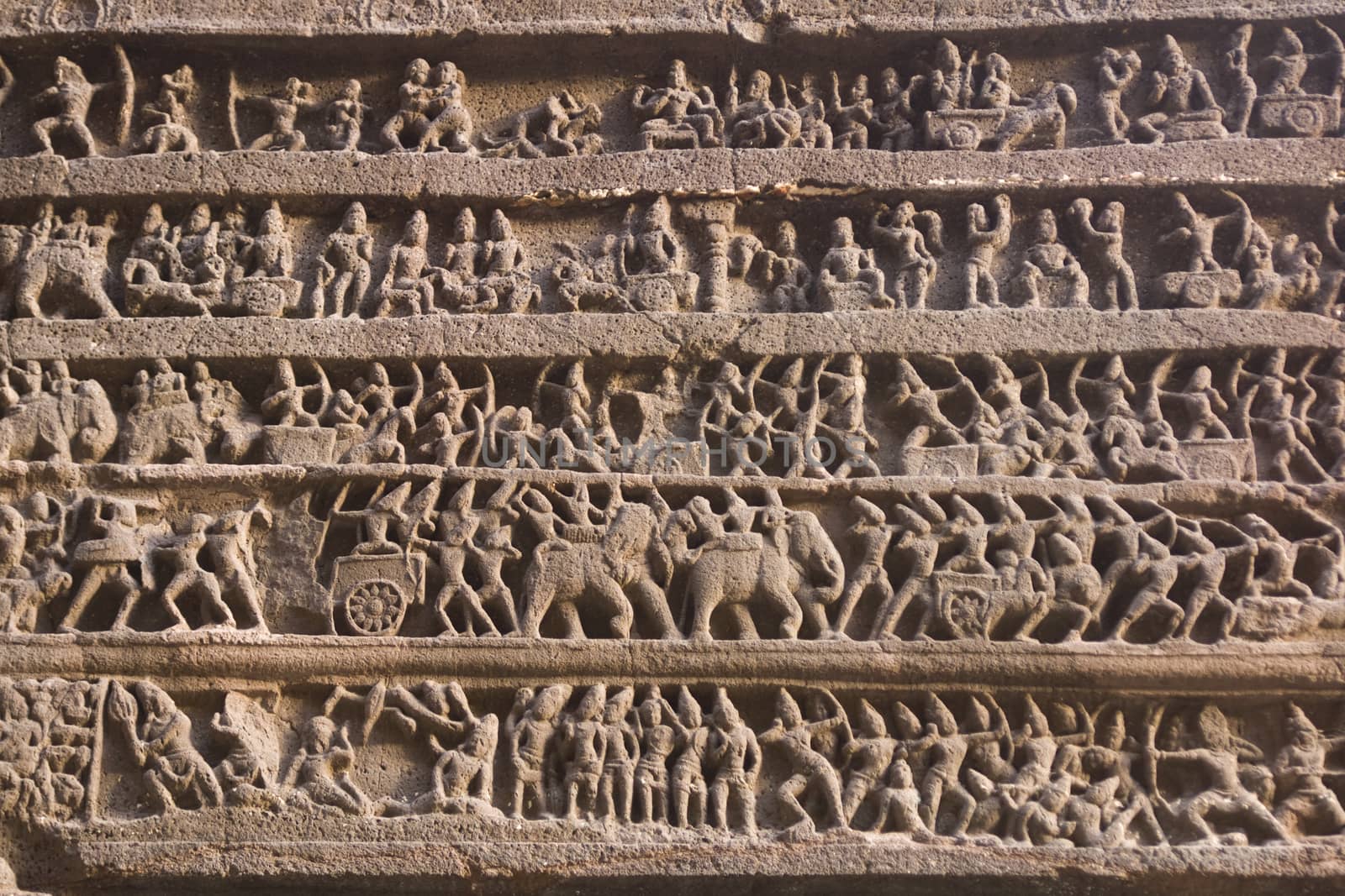 Hindu religious story carved into the rock face at the ancient Hindu Temple (Kailas Temple). Cave number 16, Ellora Caves site, India. 8th Century AD