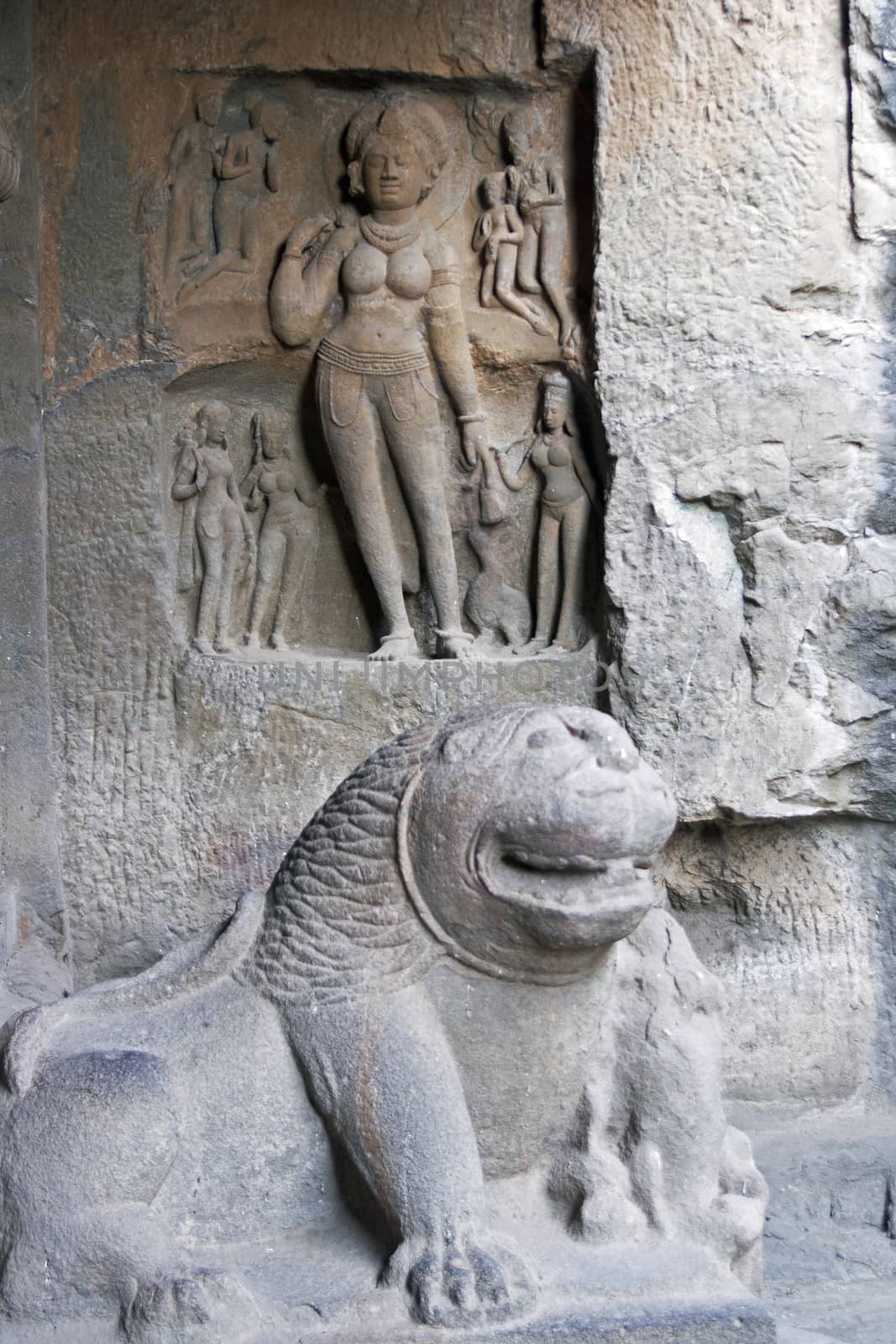 Statue of a lion guarding the entrance to the Hindu rock temple (Sita Ki Nahani), part of the Ellora Caves site in India