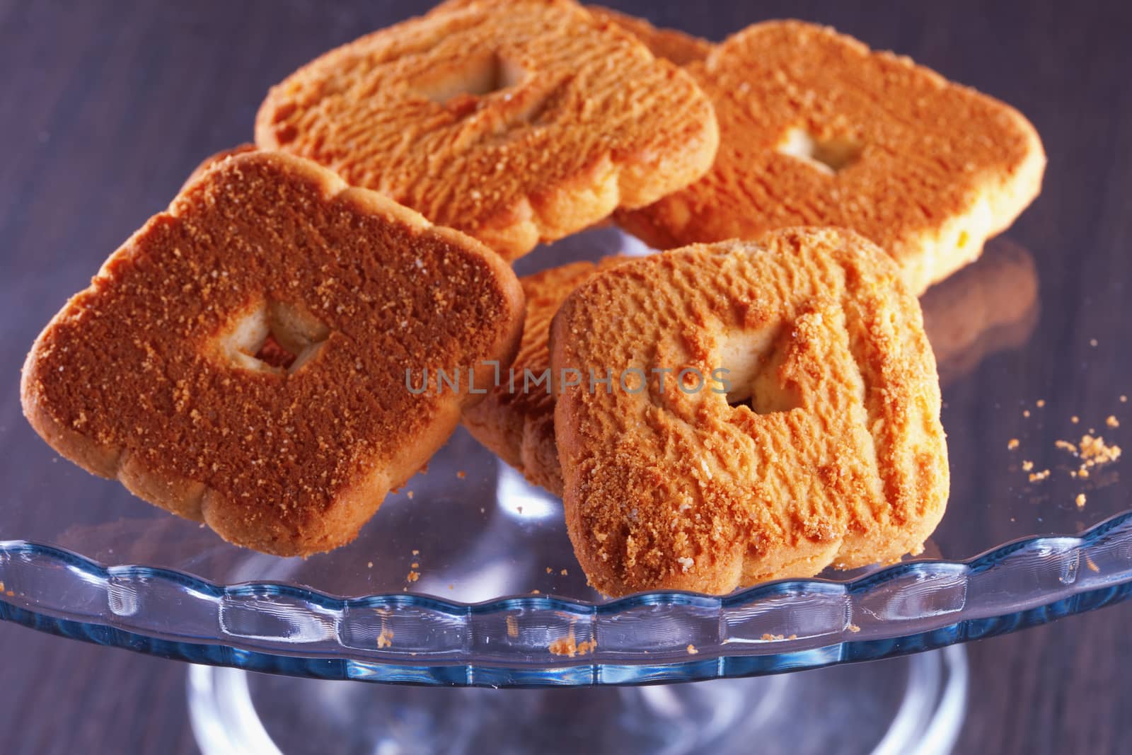 Some biscuits over a glass stand, close up