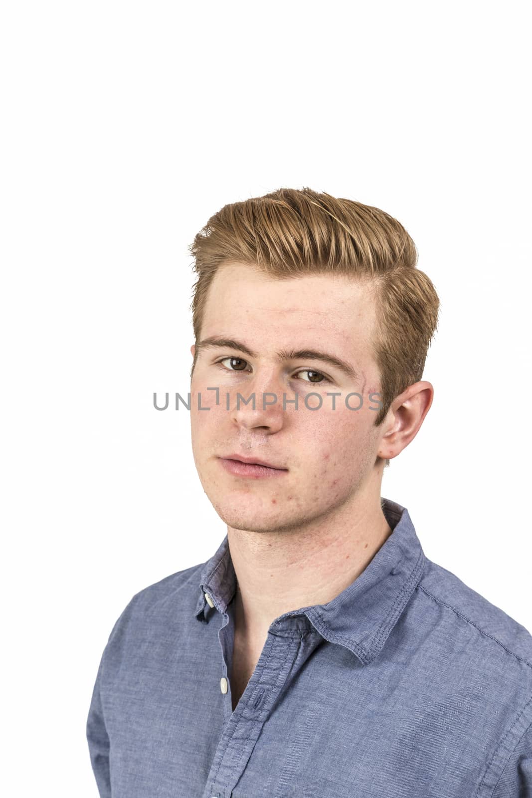 portrait of cool boy with red hair posing in studio