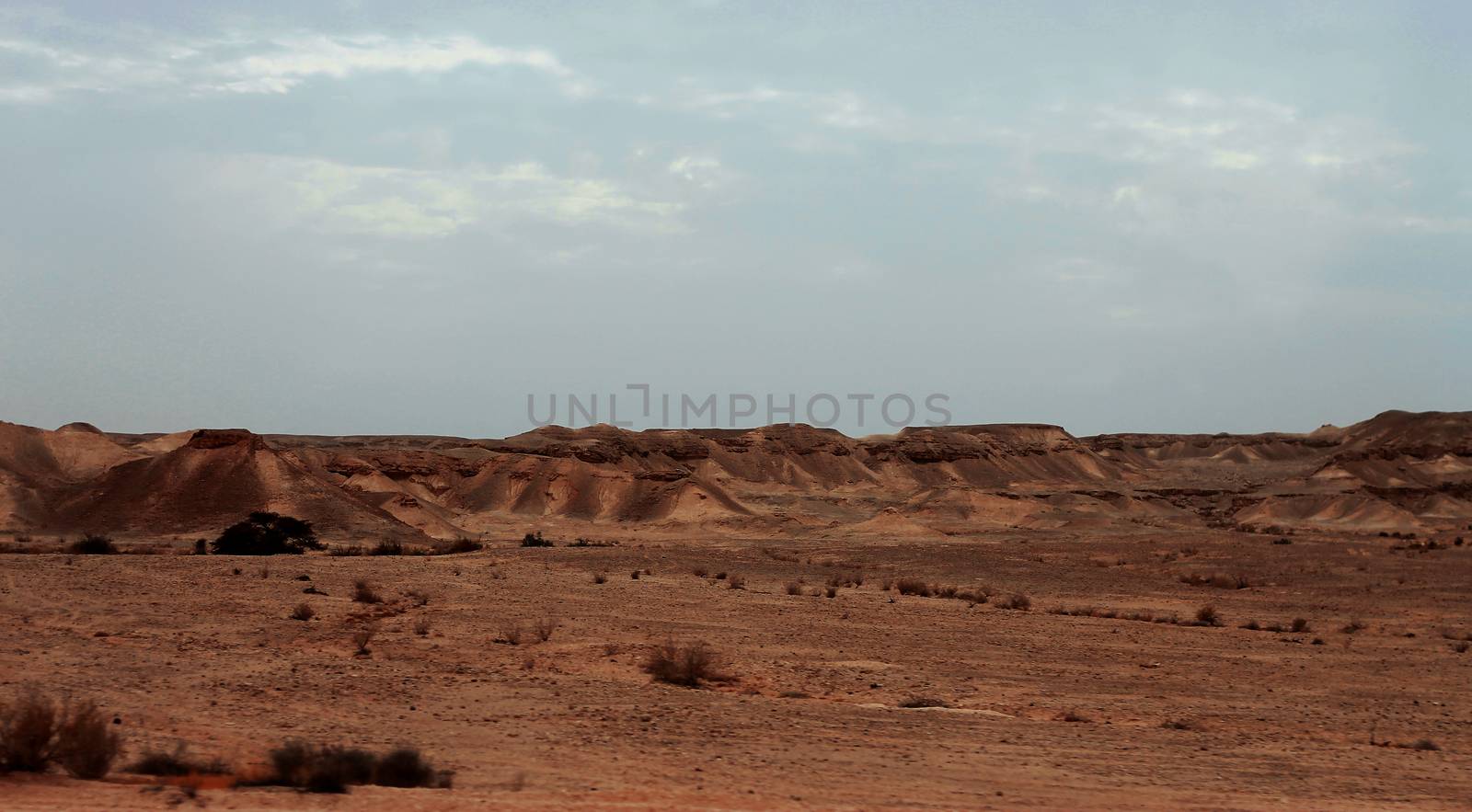 An Egyptian Desert And Mysty Sky in the daylight