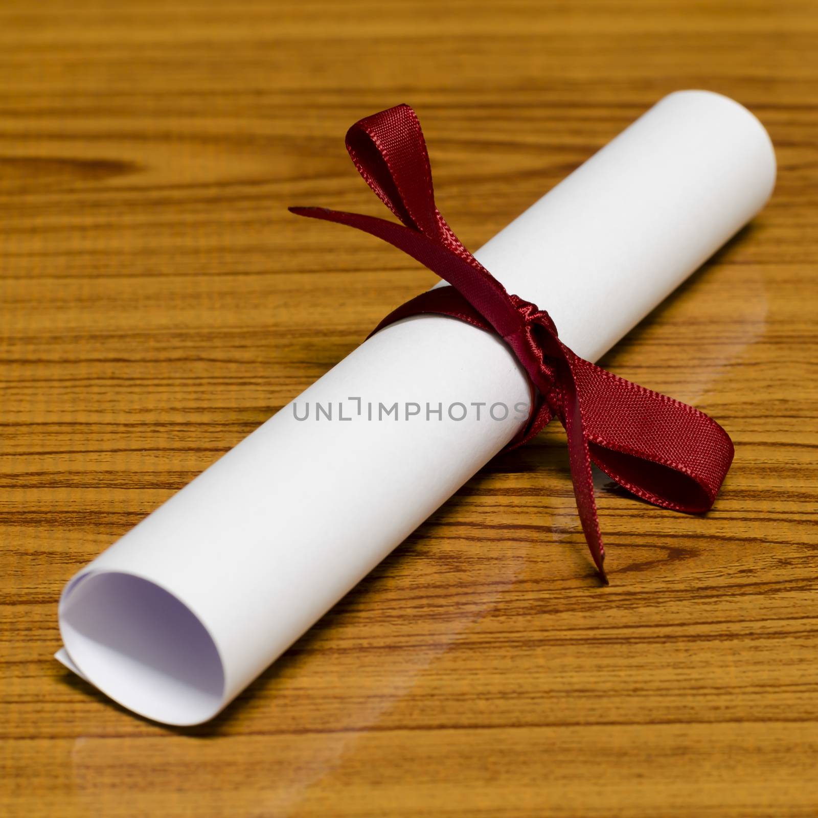 diploma on wood background