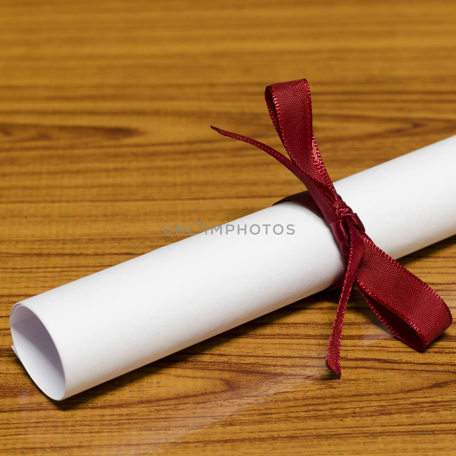 diploma on wood background