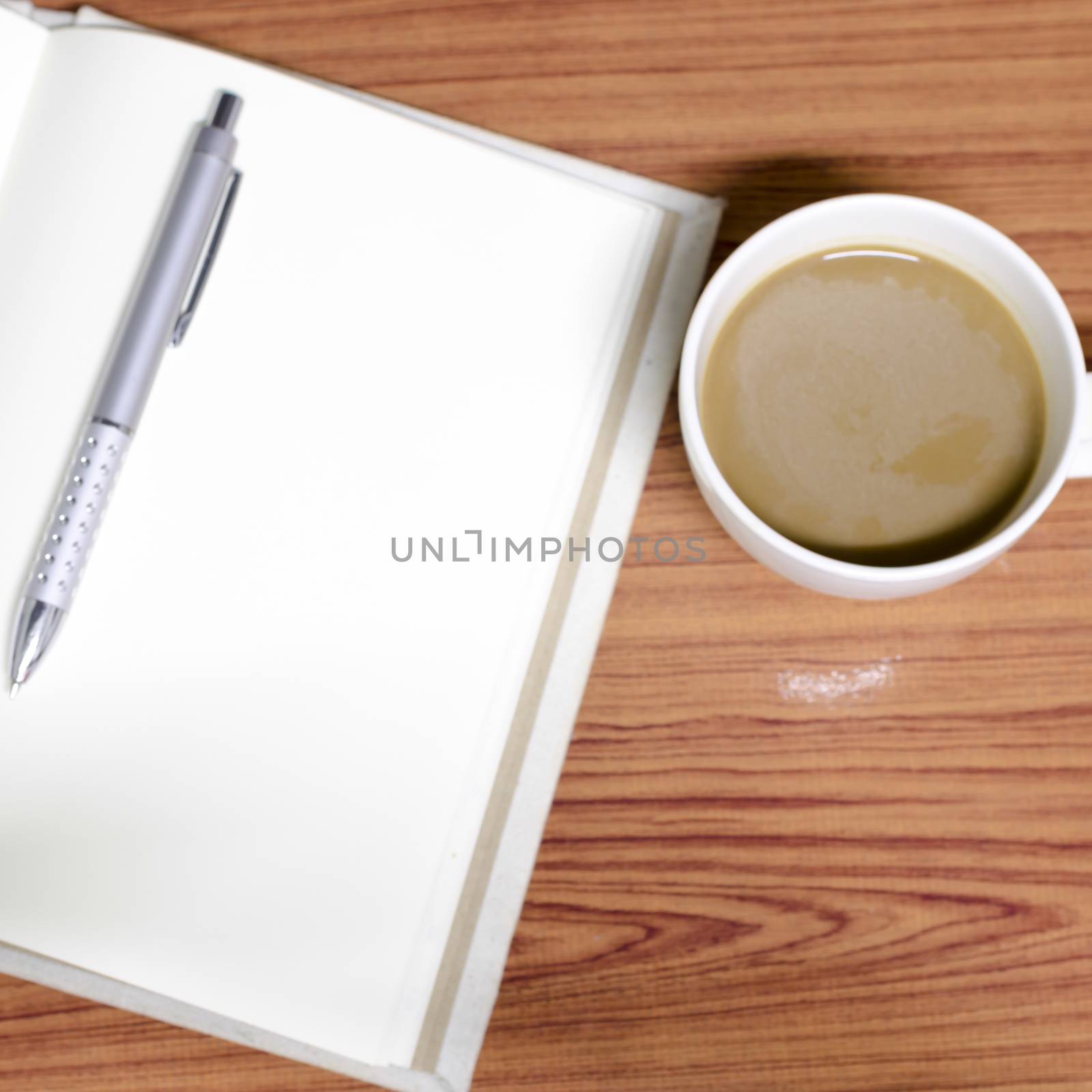 coffee and notebook on wood background concept coffee time