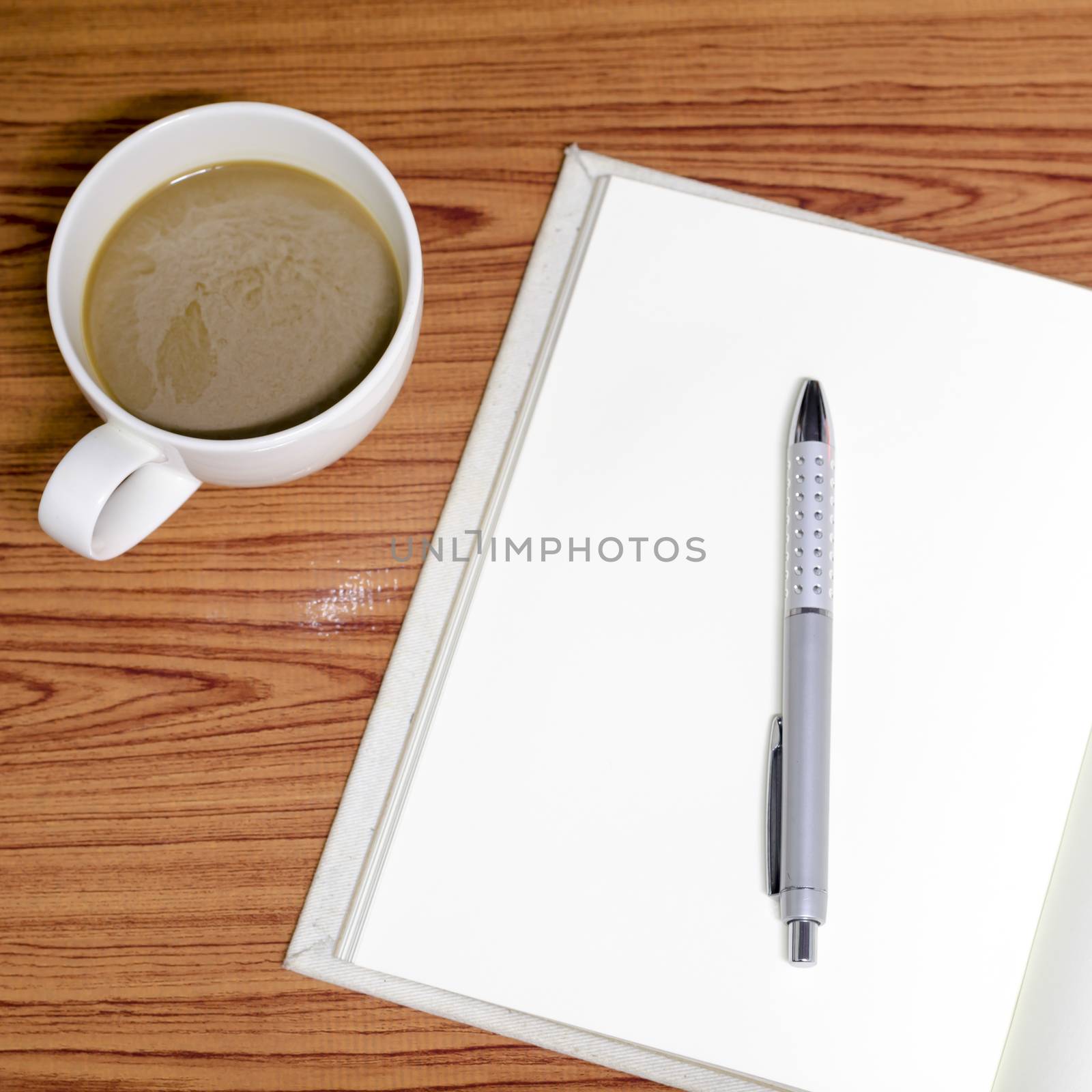 coffee and notebook on wood background concept coffee time