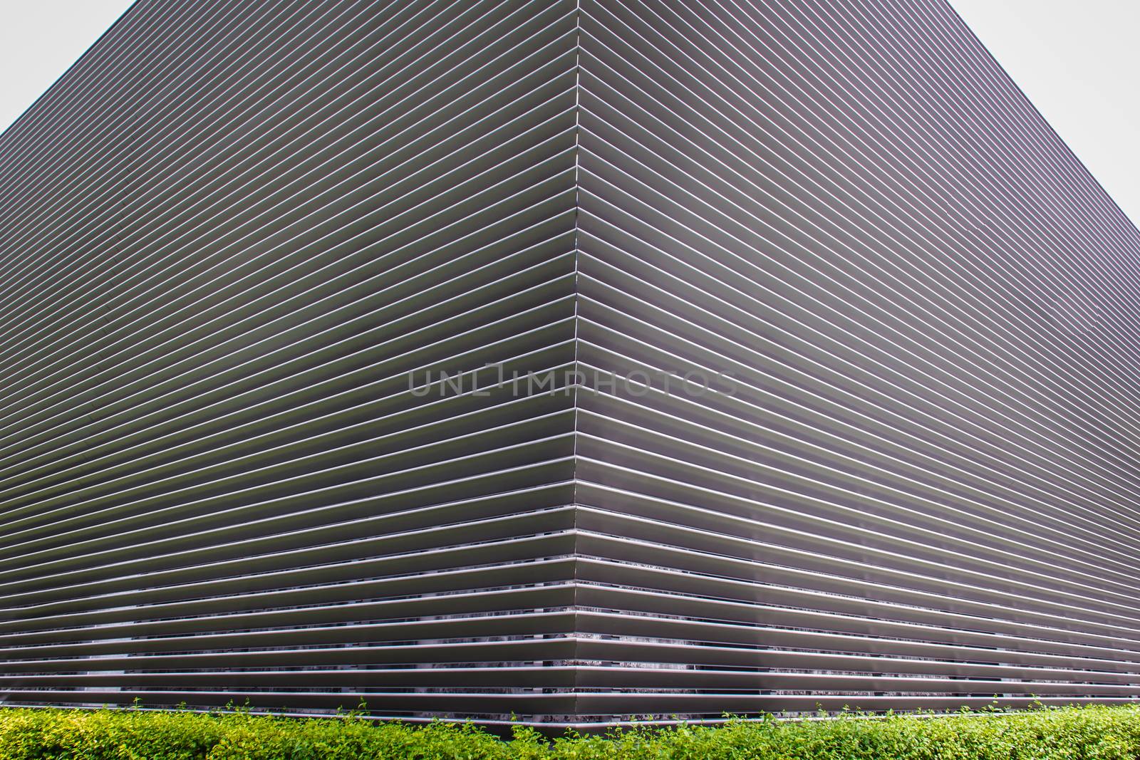 texture of steel ventilation grille on the wall of a building