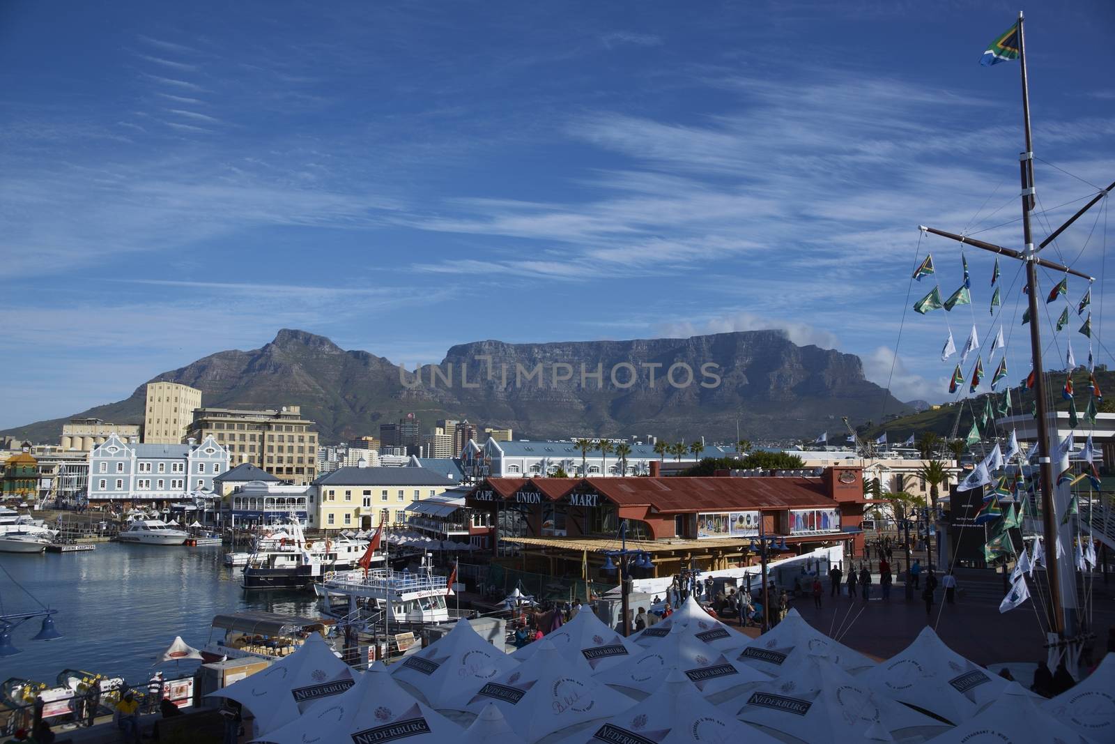 Historic buildings and restaurants in the Victoria and Albert Waterfront in Cape Town in South Africa. Table Mountain in the background.
