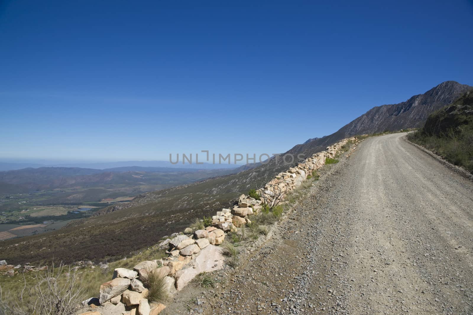 Gravel road heading up to the Swartberg Pass in the Oudtshoorn region of the Western Cape in South Africa