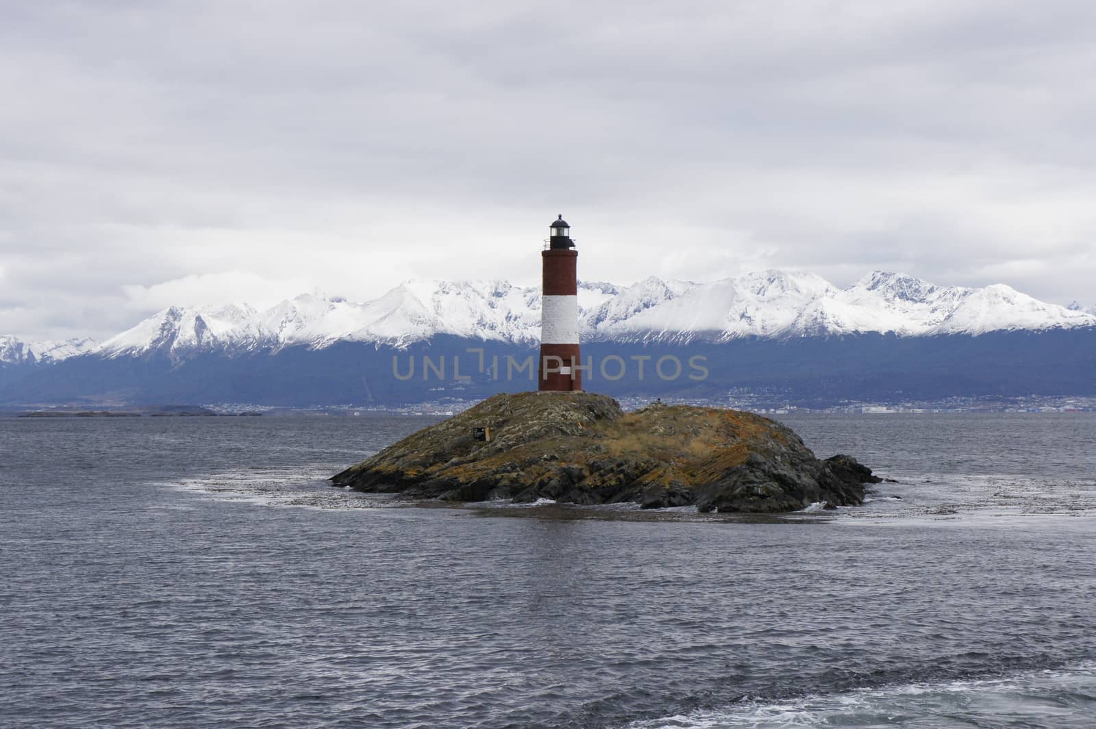 The Lighthouse at the End of the World. Far away we can see Ushuaia