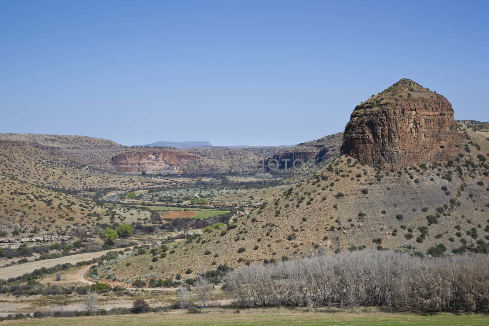 Rock formations in a wide river valley in the Karoo. South Africa