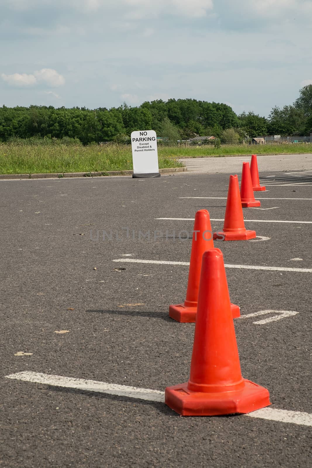 Traffic cones in car park by sijohnsen