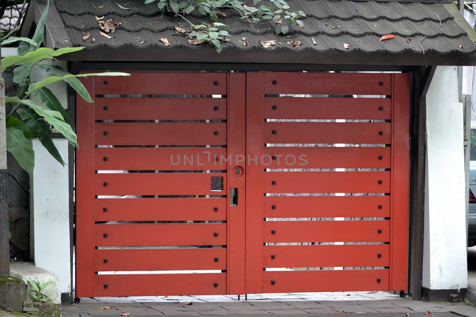 red wooden gate with black terraccota roof model