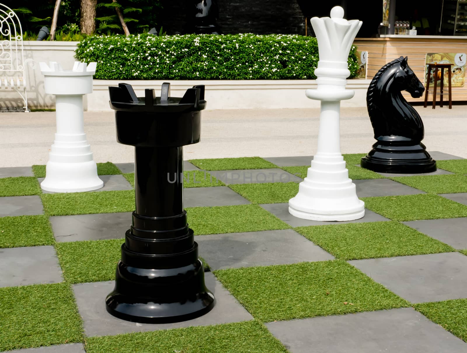 outdoor chess board and big chess on the garden