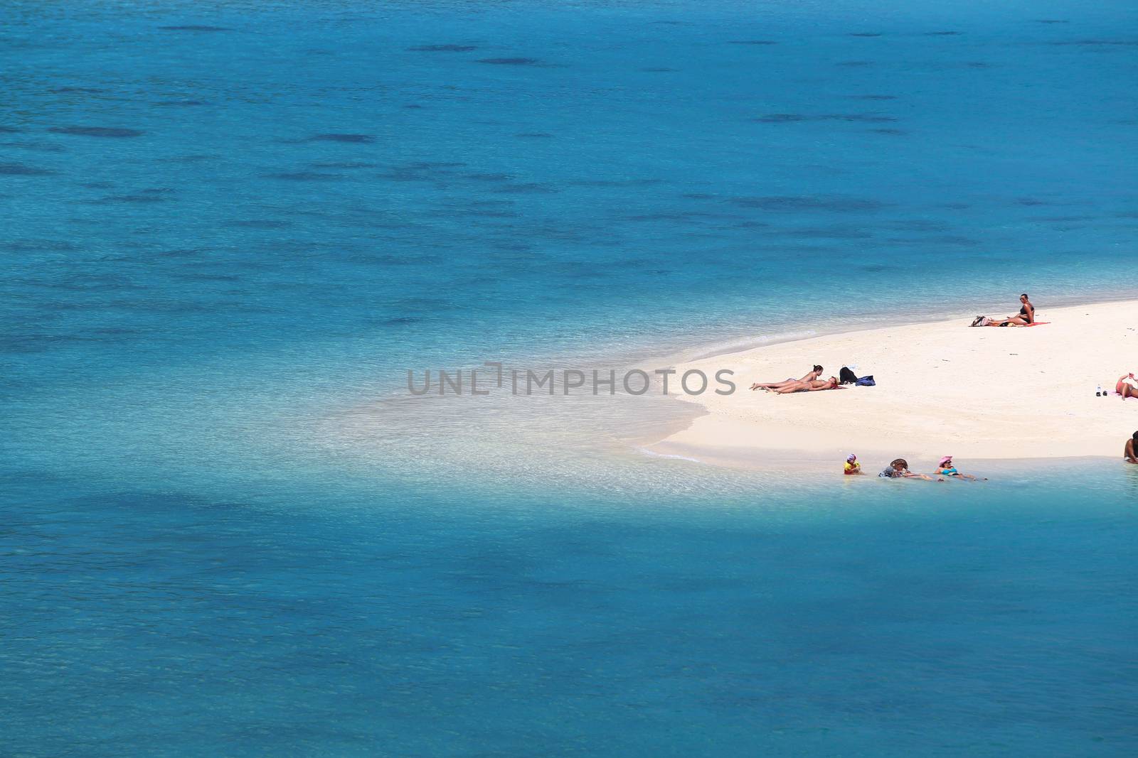 SATUN, THAILAND-February 4: Unidentified people visit  Mountain beach in Lipe island on February 4, 2014 in Satun province, Thailand. There are 3 beaches named Pattaya, Sunrise, and Sunset in Lipe island