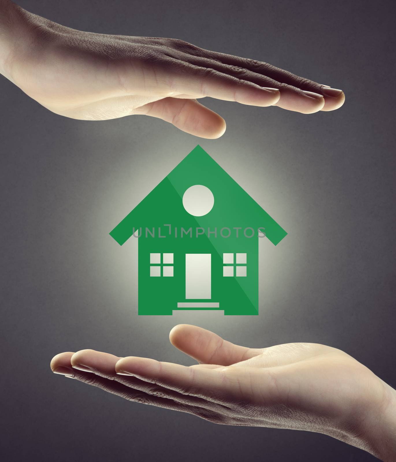 Hands protecting green house icon on white background, home insurance and safety concept.