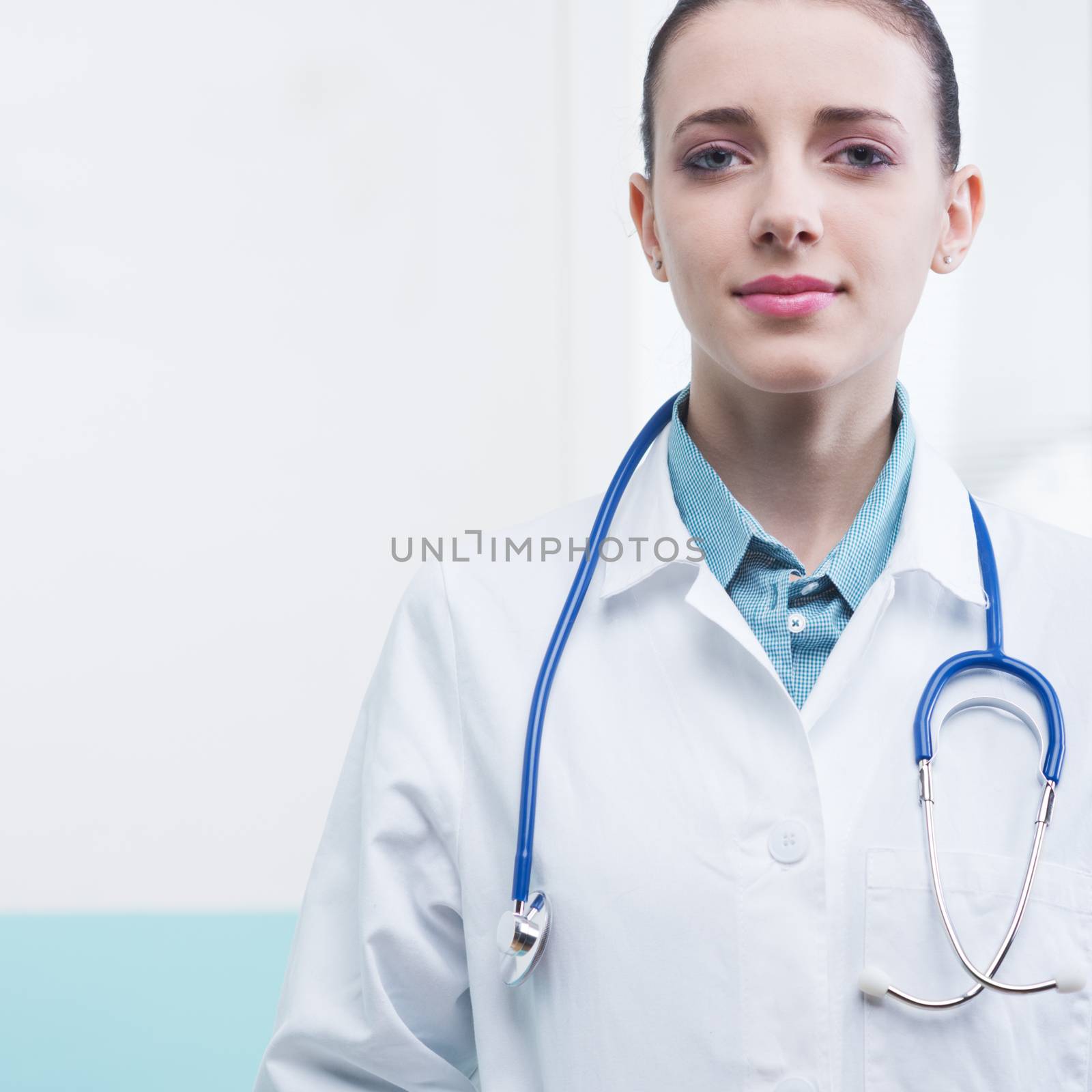 Portrait of a female doctor standing in office