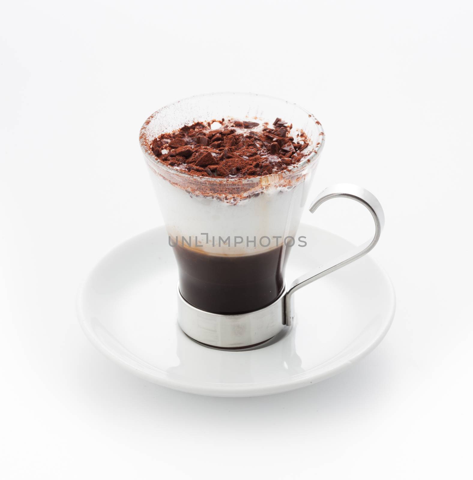 Garnished coffee with cream topping in elegant cup.