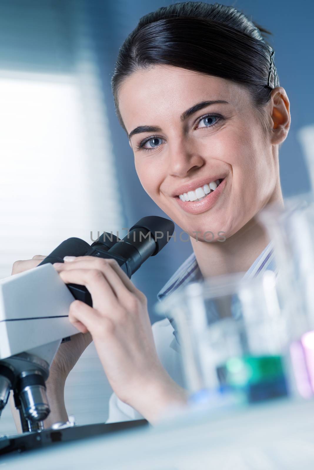 Female researcher smiling by stokkete