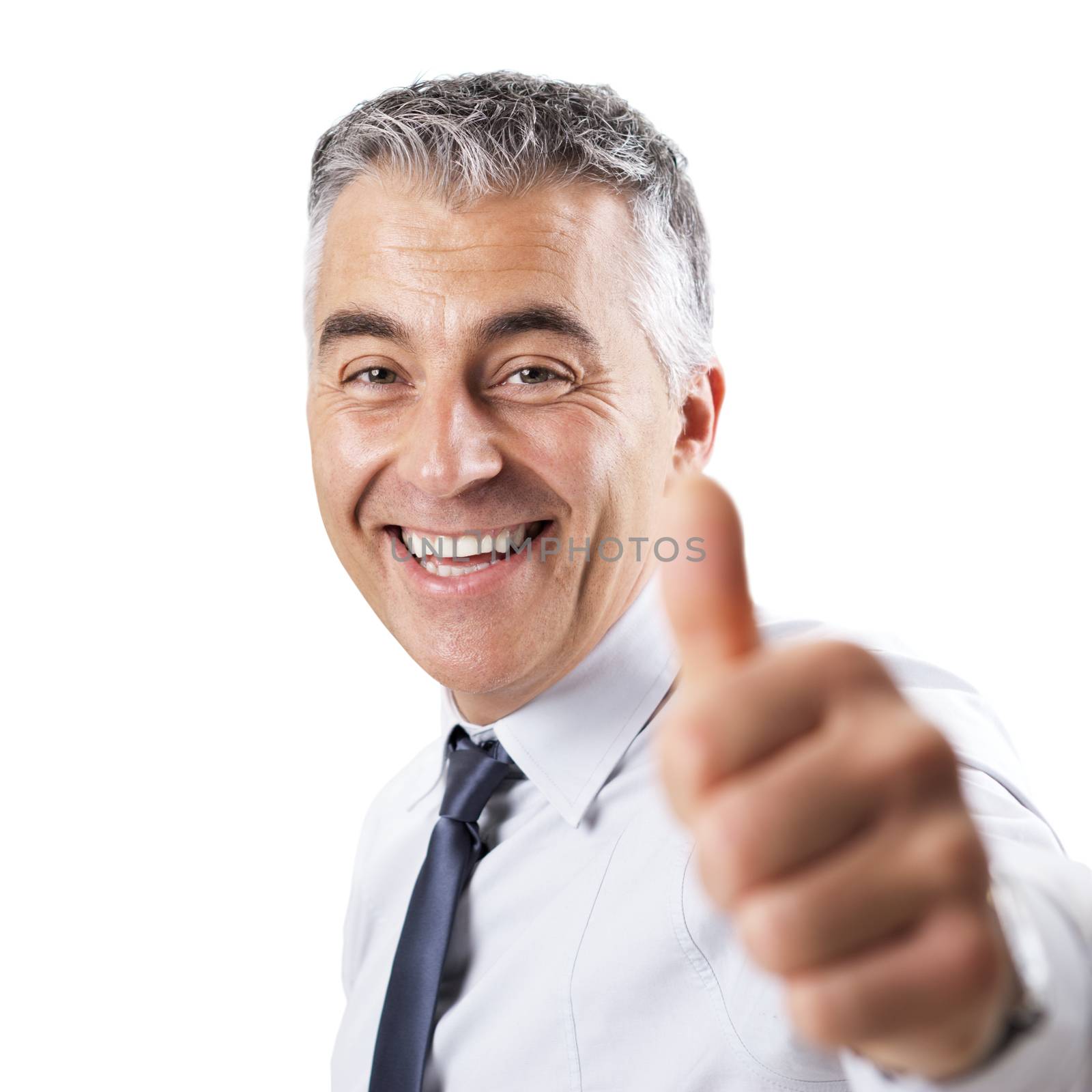 Smiling confident businessman tumbs up on white background.