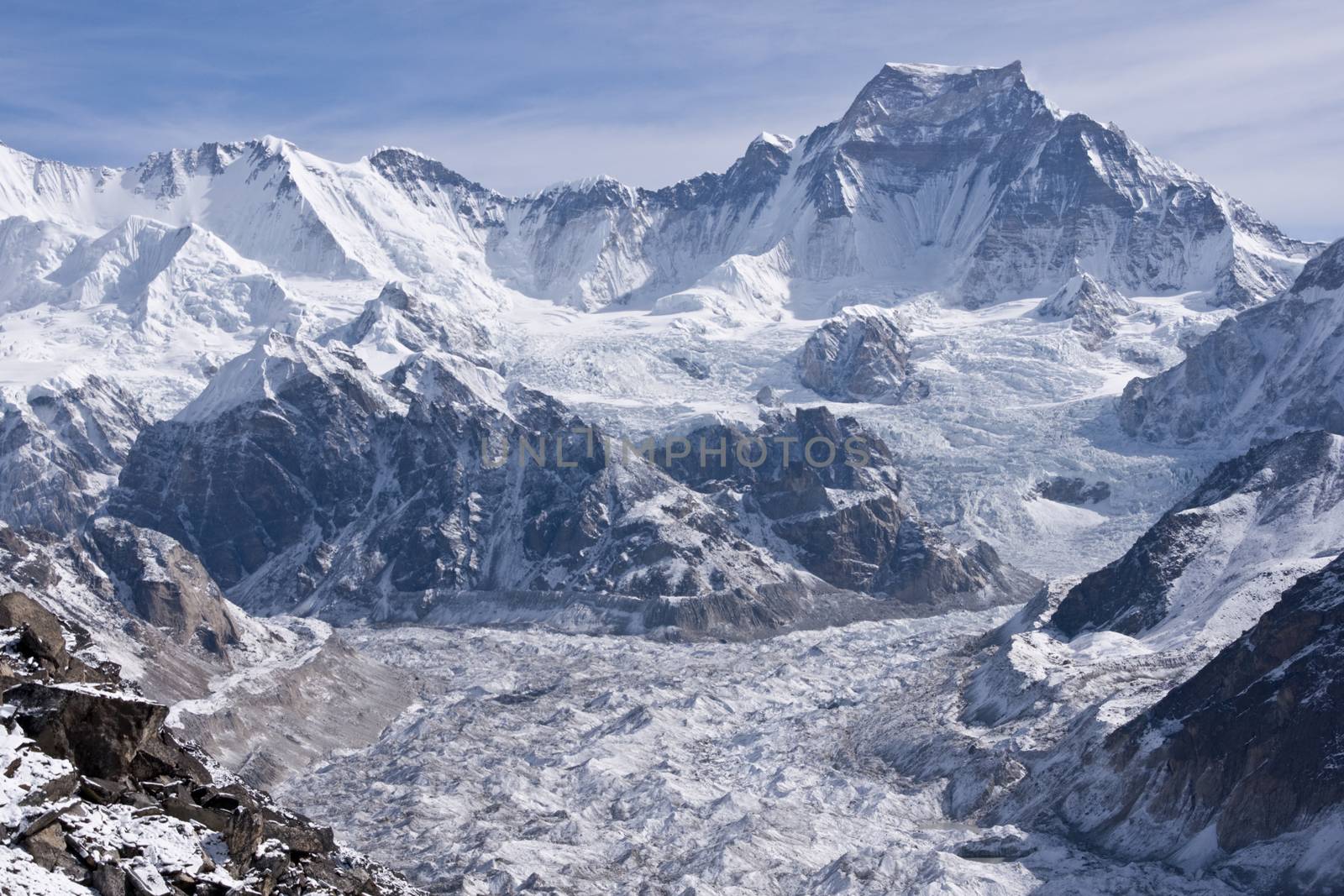 Ngozumpa Glacier flowing down from the high snow capped mountains of the Himalayas. View from Gokyo Ri, 5360 meters up in the Himalaya Mountains of Nepal