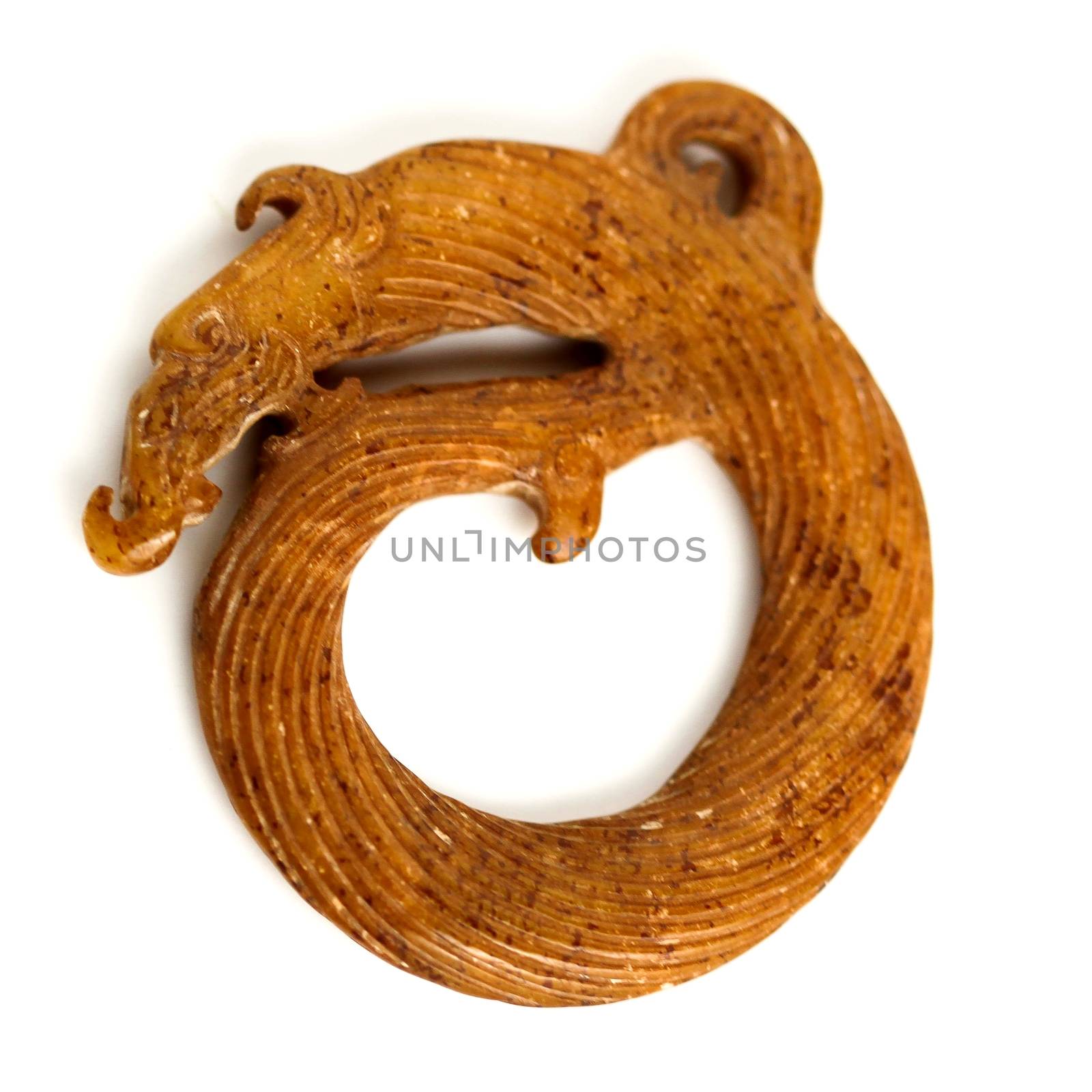 A Chinese brown jade ring on white background.