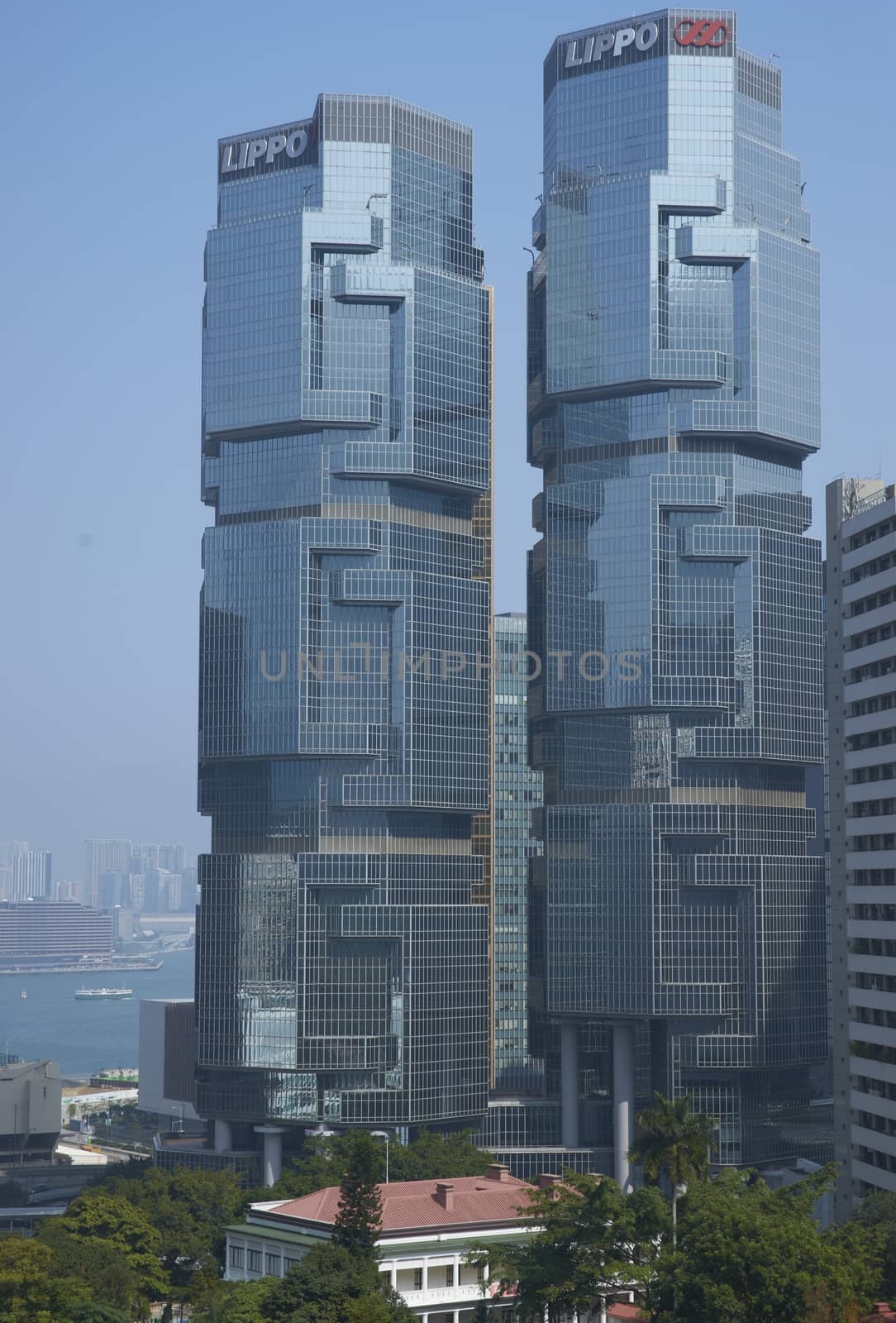 Modern architecture of the financial district towers above a city park in Hong Kong, China