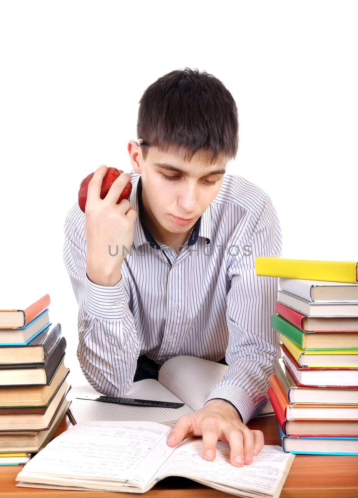 Student preparing for Exam at the School Desk on the White Background