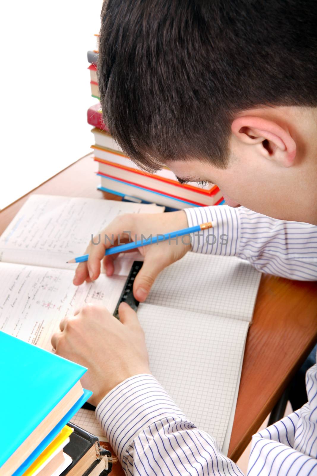 Teenager preparing for Exam by sabphoto