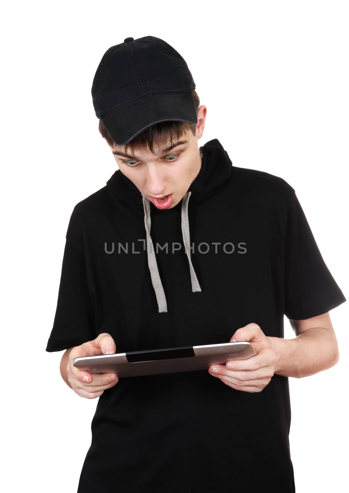 Surprised Teenager with Tablet Computer Isolated on the White Background